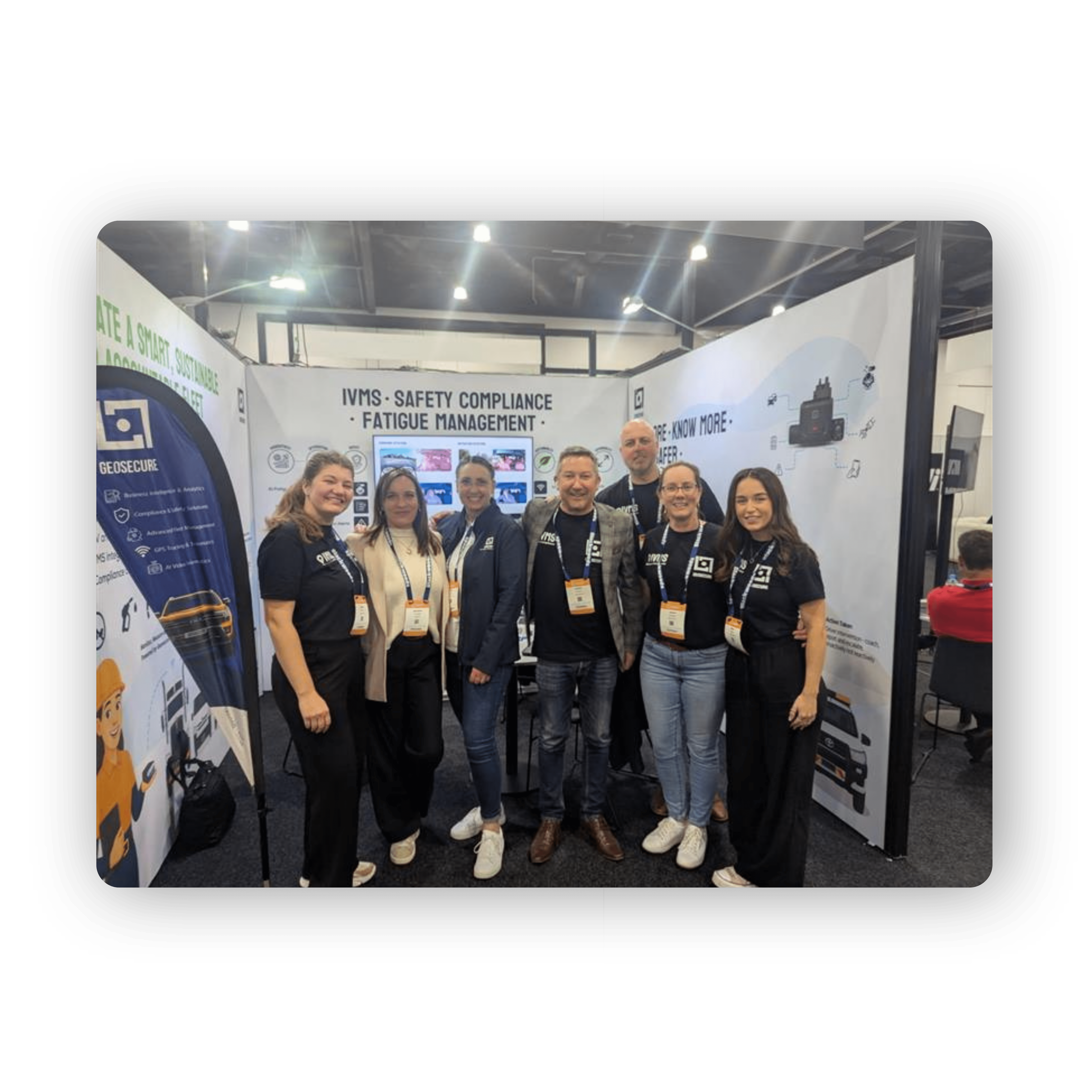 Two Geotab GO devices stacked together, showing the front label which features the Geotab logo and icons representing power, GPS signal, and network connectivity. The devices are compact, black, rectangular units with a glossy surface and are used for vehicle telematics and fleet tracking.