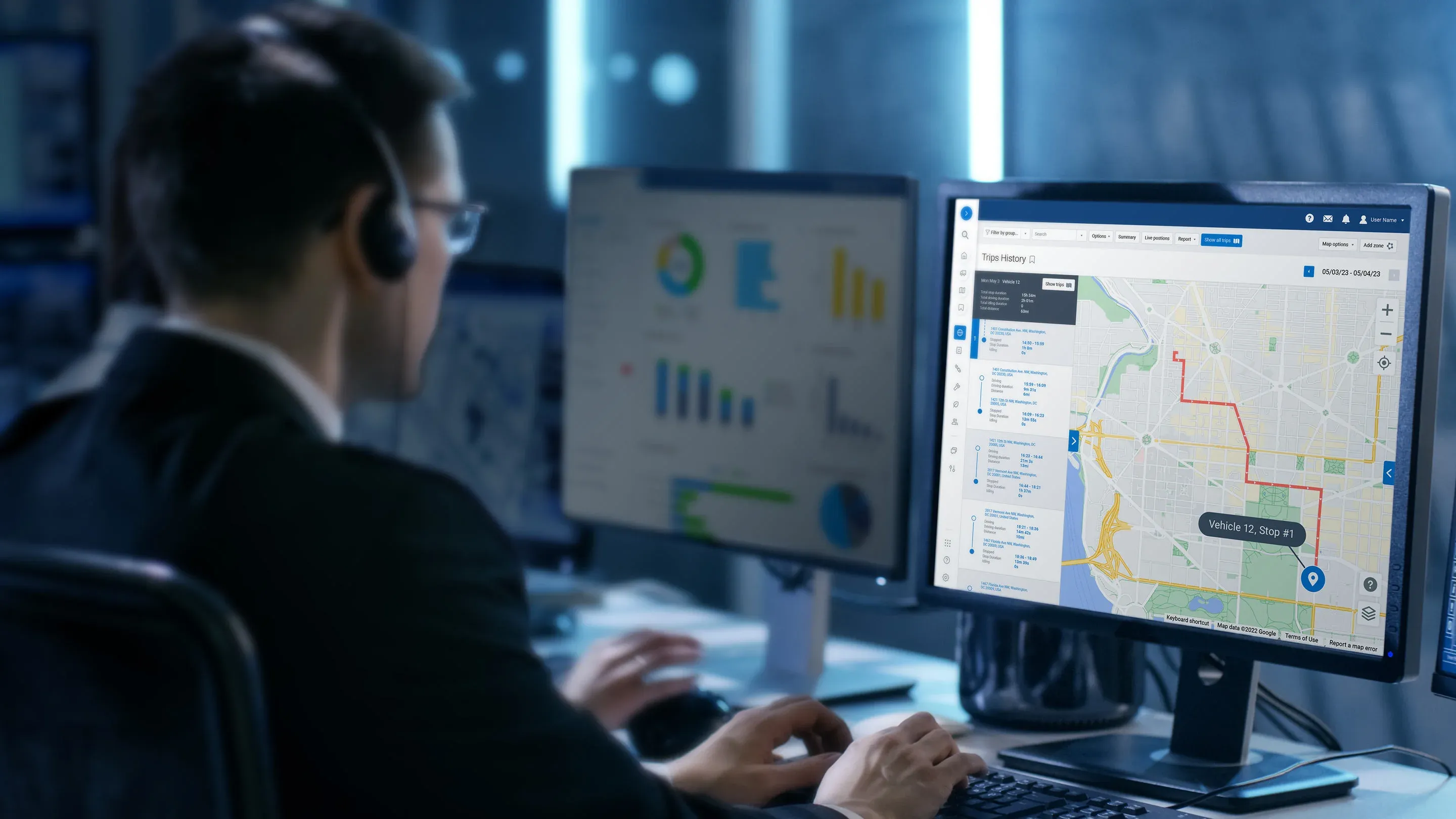 A fleet manager wearing a headset monitors real-time vehicle routes and driver behaviour on the myGeotab platform.