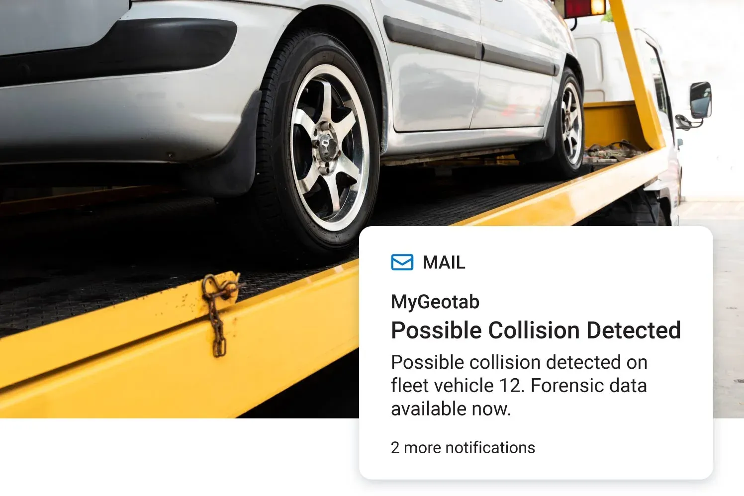 A notification from MyGeotab alerts about a possible collision detected for fleet vehicle 12, with forensic data available for review.