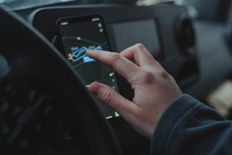 Person Using black android for gps